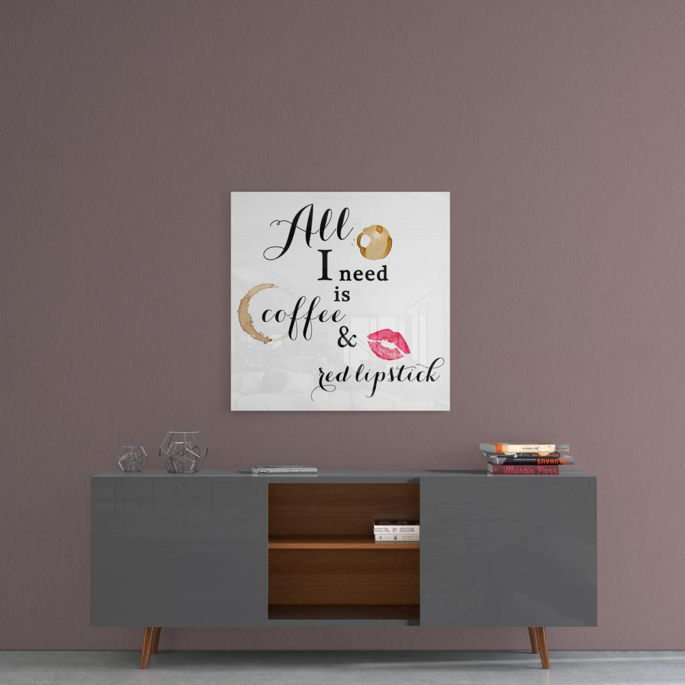 Square glass wall art with "All I need is coffee & red lipstick" text and watercolor coffee and lip illustrations displayed above gray mid-century modern credenza.