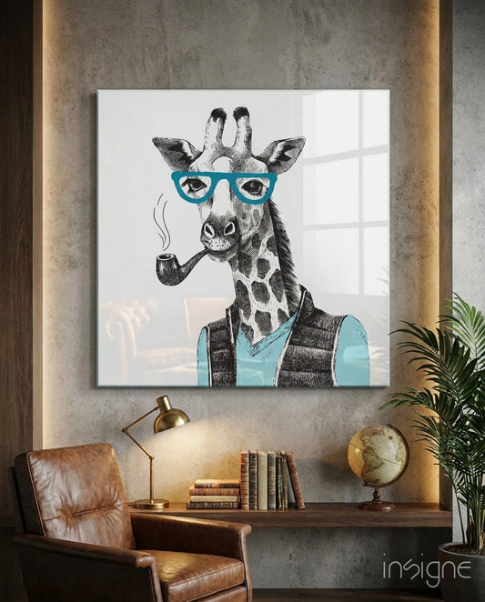 Mr. Giraffe Glass Wall Art displayed on concrete wall above desk with leather chair, lamp, books, and globe visible below.