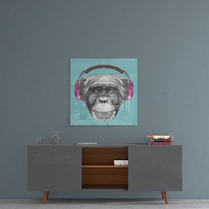 Monkey Glass Wall Art displayed above a mid-century modern console table, featuring a chimpanzee wearing pink headphones against a turquoise background.