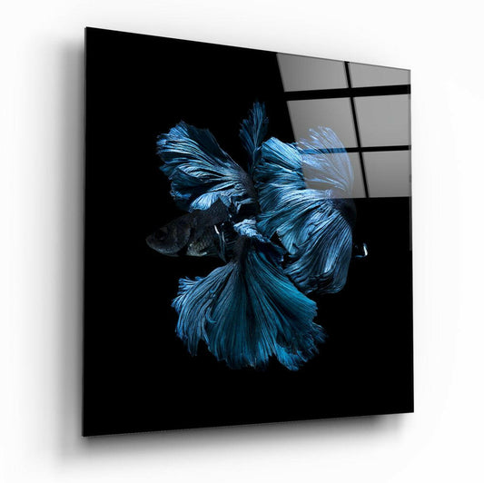 Angled perspective view of glass wall art displaying a vibrant blue betta fish against black background with grid pattern overlay.