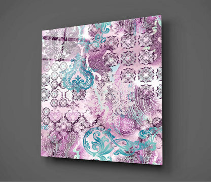 Angled perspective of purple damask glass wall art displaying turquoise and pink ornamental patterns against gray background.