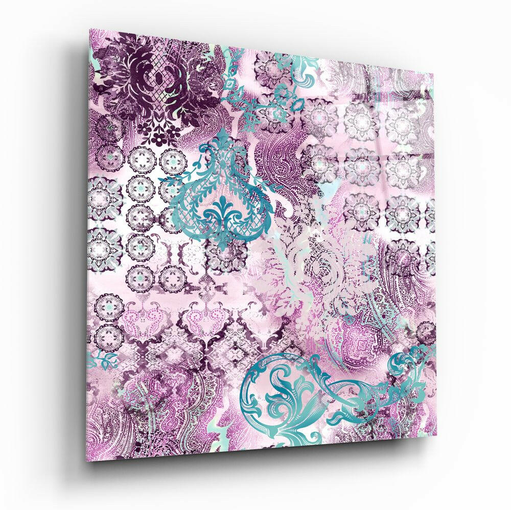 Angled perspective of purple damask glass wall art panel displaying intricate floral patterns and turquoise ornamental motifs on light background.
