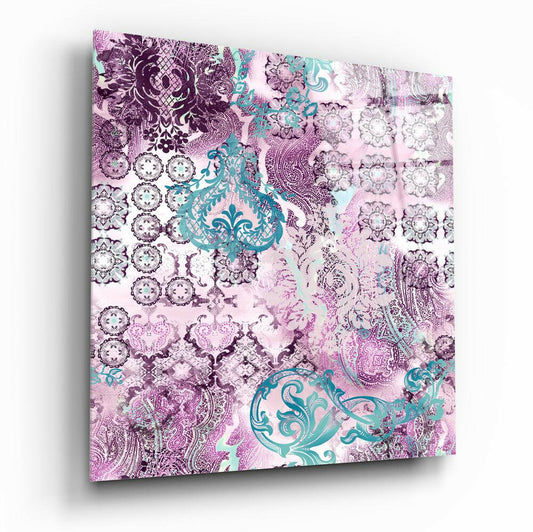 Angled perspective of purple damask glass wall art panel displaying intricate floral patterns and turquoise ornamental motifs on light background.