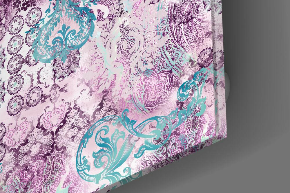 Close-up angled view of purple damask glass wall art showing turquoise and pink ornamental patterns with textured surface details.