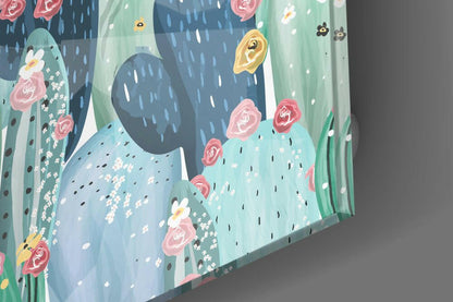 Angled side view of glass wall art featuring illustrated cacti with pink roses, white flowers, and yellow blooms against blue and green layered background.