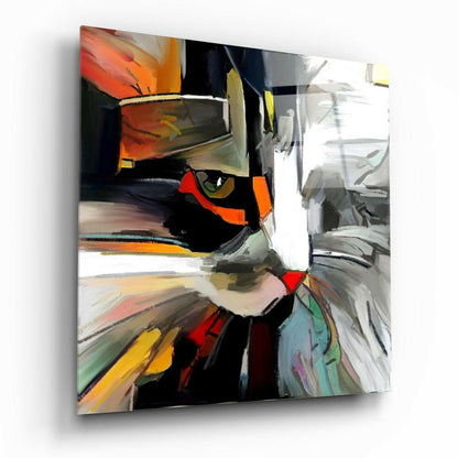 Abstract cat face in vibrant orange, red, and black colors on glass panel, angled three-quarter view.