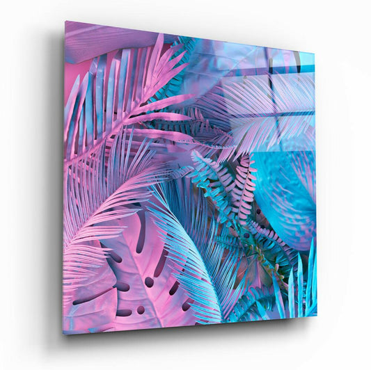 Angled perspective of glass wall art displaying layered neon pink and cyan tropical palm leaves with shadow depth effect.