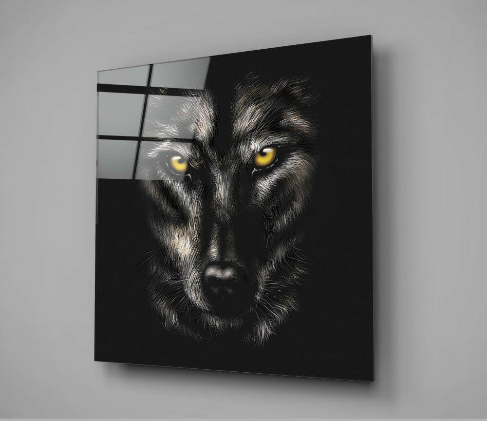 Black glass wall art featuring a close-up wolf face with striking yellow eyes against dark background, mounted at angle.
