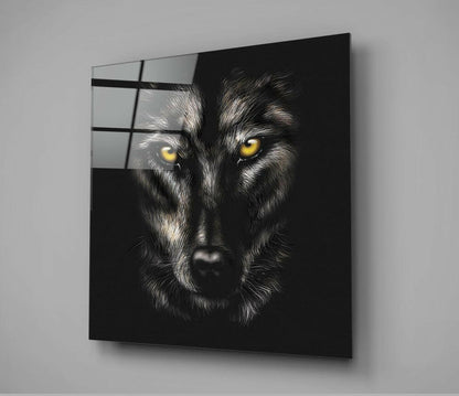 Black glass wall art featuring a close-up wolf face with striking yellow eyes against dark background, mounted at angle.