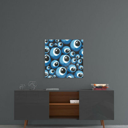 Blue evil eye beads glass wall art hanging above mid-century modern console table with geometric decor and stacked books.