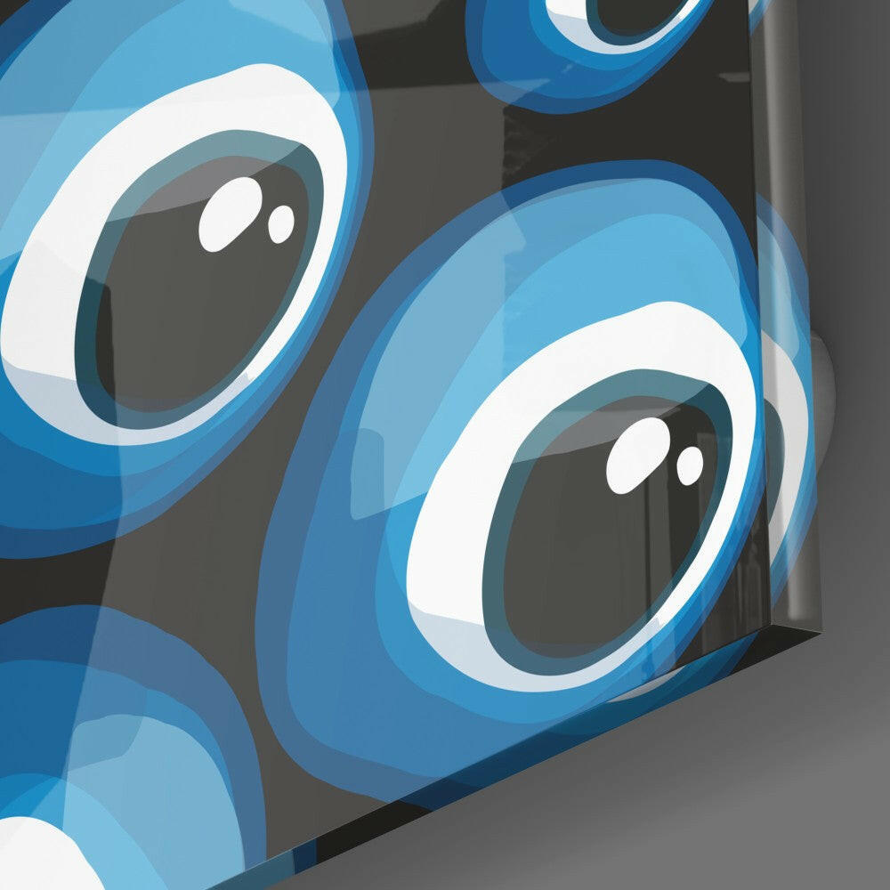 Close-up angled view of layered blue and white glass evil eye beads against gray background.