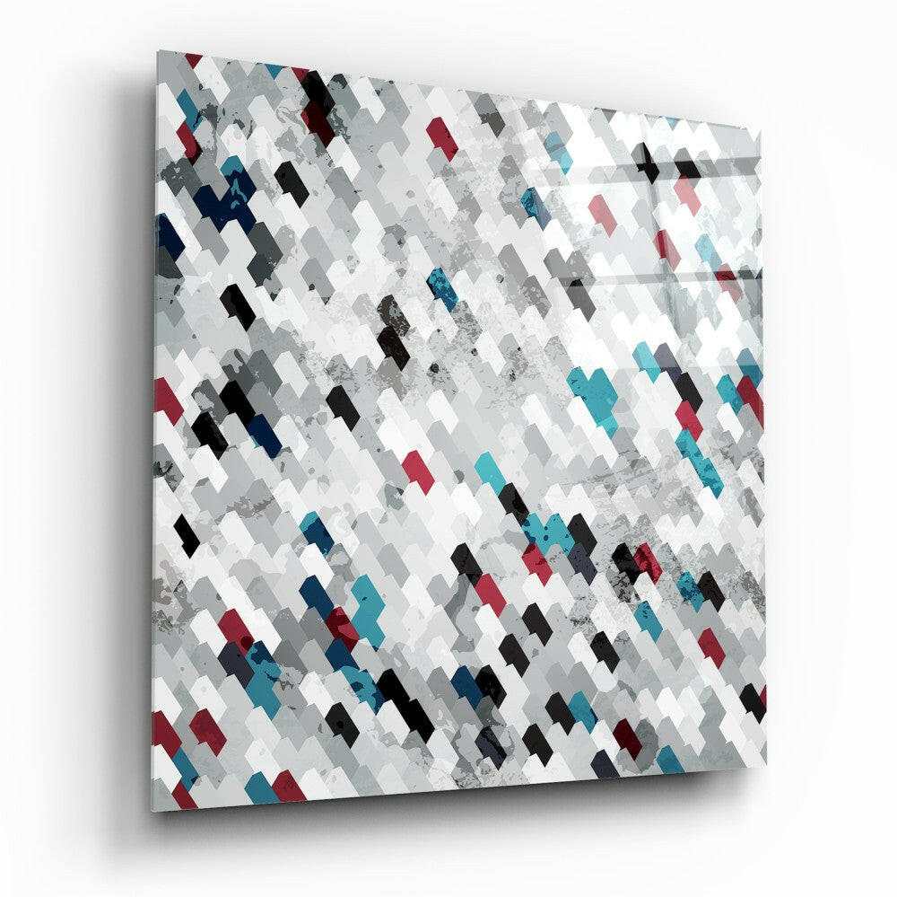 Square glass wall art panel with diagonal geometric pattern of gray, white, black, teal, and burgundy tiles with textured overlay.