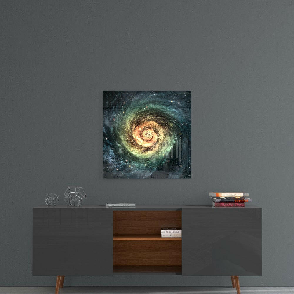 Glass wall art featuring a golden spiral galaxy with teal and dark blue tones hung above a mid-century modern console table.