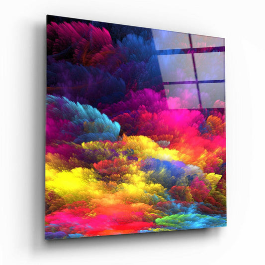 Angled perspective view of colorful feather cloud glass wall art displaying vibrant magenta, yellow, blue, and orange swirling patterns with window grid overlay.