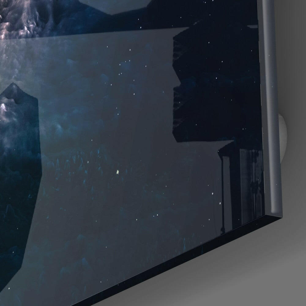 Black hole glass wall art mounted on white wall showing dark space scene with silhouetted celestial structures and scattered stars.