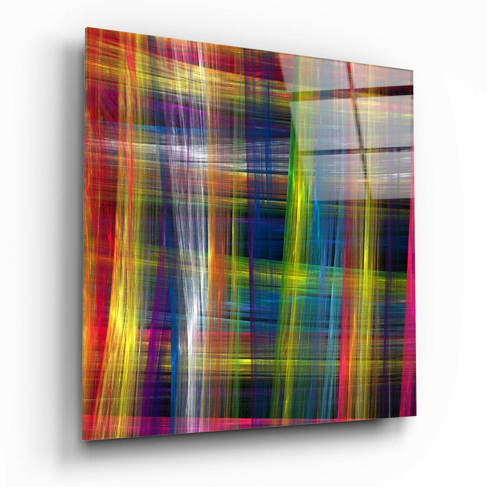 Angled three-quarter view of a square glass panel with vibrant intersecting vertical and horizontal streaks of red, yellow, blue, green, and white creating an abstract pattern.