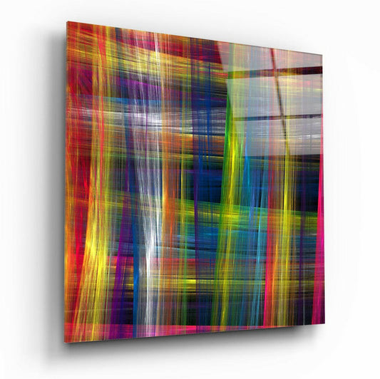 Angled three-quarter view of a square glass panel with vibrant intersecting vertical and horizontal streaks of red, yellow, blue, green, and white creating an abstract pattern.