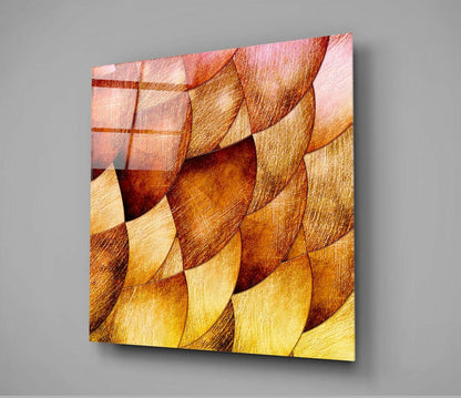 Gold Shells Glass Wall Art displayed at an angle, showing overlapping shell-shaped tiles in warm gold, amber, and coral tones with textured surfaces.