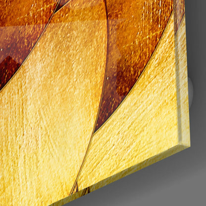 Close-up angled view of layered gold and amber glass panels with textured surface detail and dimensional edges.