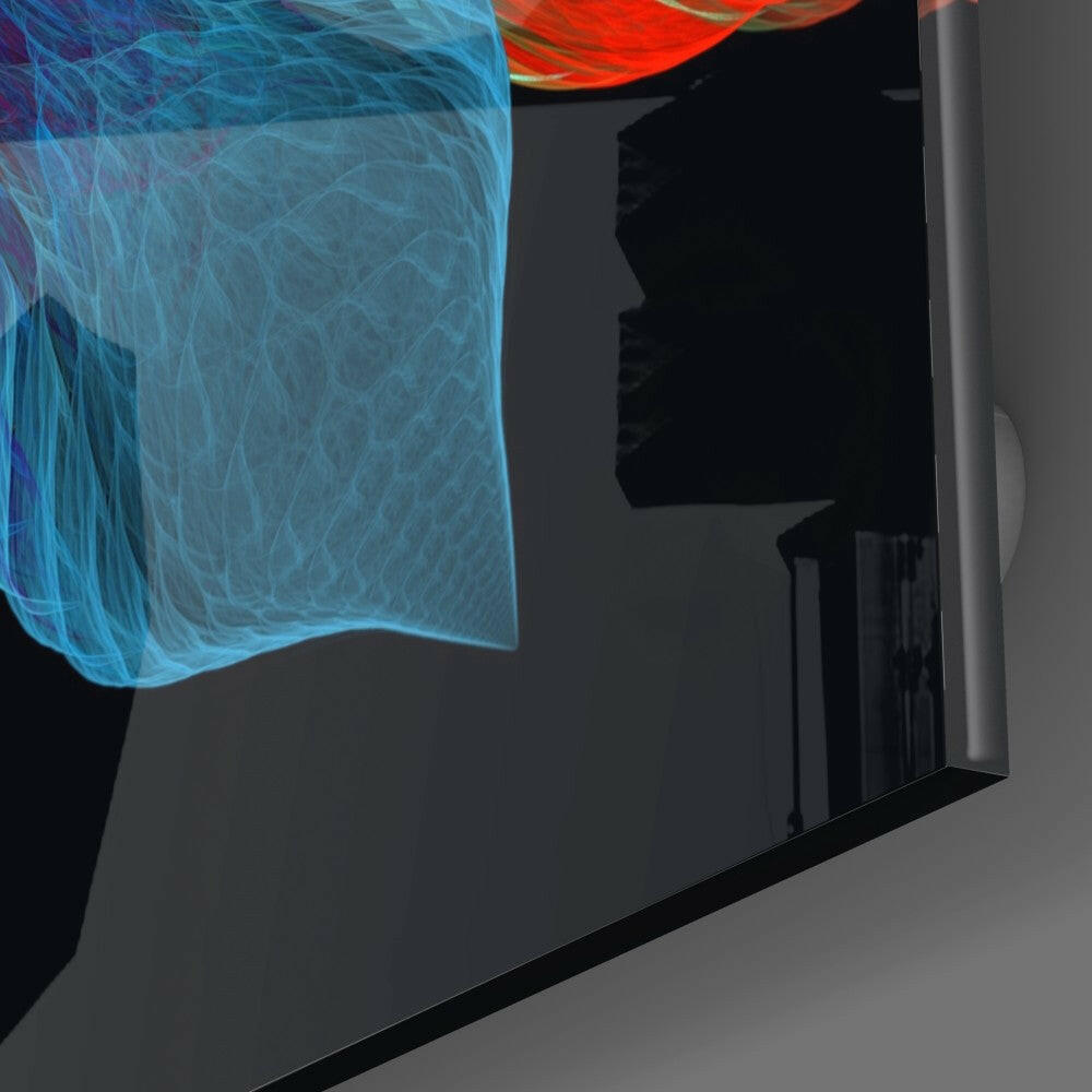 Close-up angled view of glass wall art displaying blue and red translucent leaf patterns mounted on dark surface.