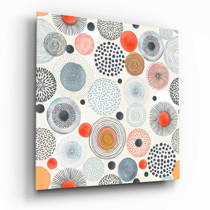 Canvas wall art displaying colorful circles with radiating patterns in orange, blue, gray, and black on cream background, angled three-quarter view.
