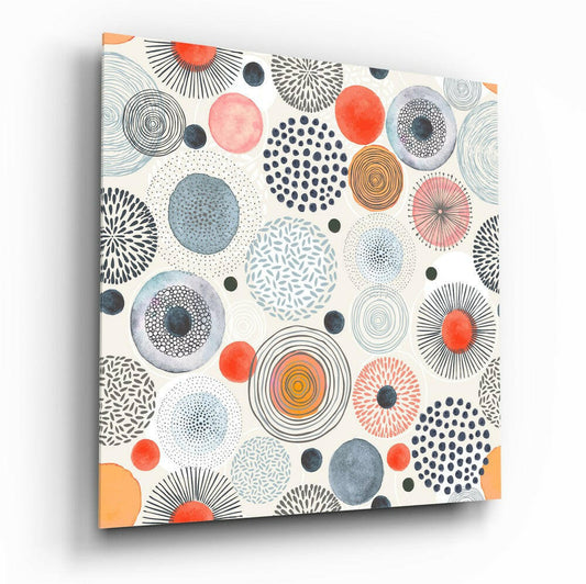 Canvas wall art displaying colorful circles with radiating patterns in orange, blue, gray, and black on cream background, angled three-quarter view.