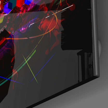 Angled side view of frosted glass wall art panel displaying vibrant red, blue, green, and yellow luminous lines and abstract shapes against dark background.