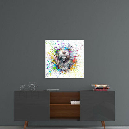 Colorful splatter skull glass art displayed on gray wall above mid-century modern console table with decorative items.