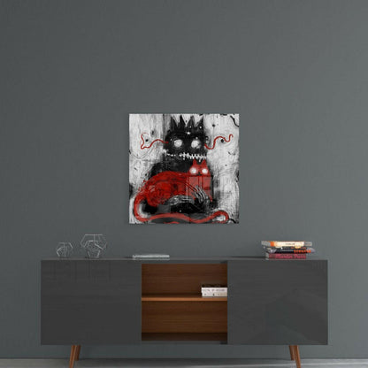 Black and red monster character artwork displayed on gray wall above mid-century modern console table with wooden drawers.
