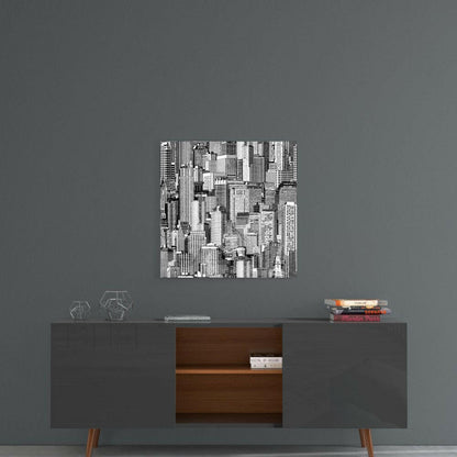 Black and white cityscape glass wall art displayed above mid-century modern console table against gray wall.