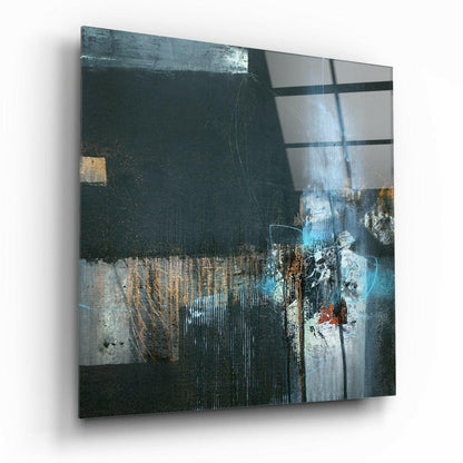 Abstract glass wall art panel with dark teal, gold, and turquoise layers featuring geometric lines and weathered texture effects, mounted at an angle.