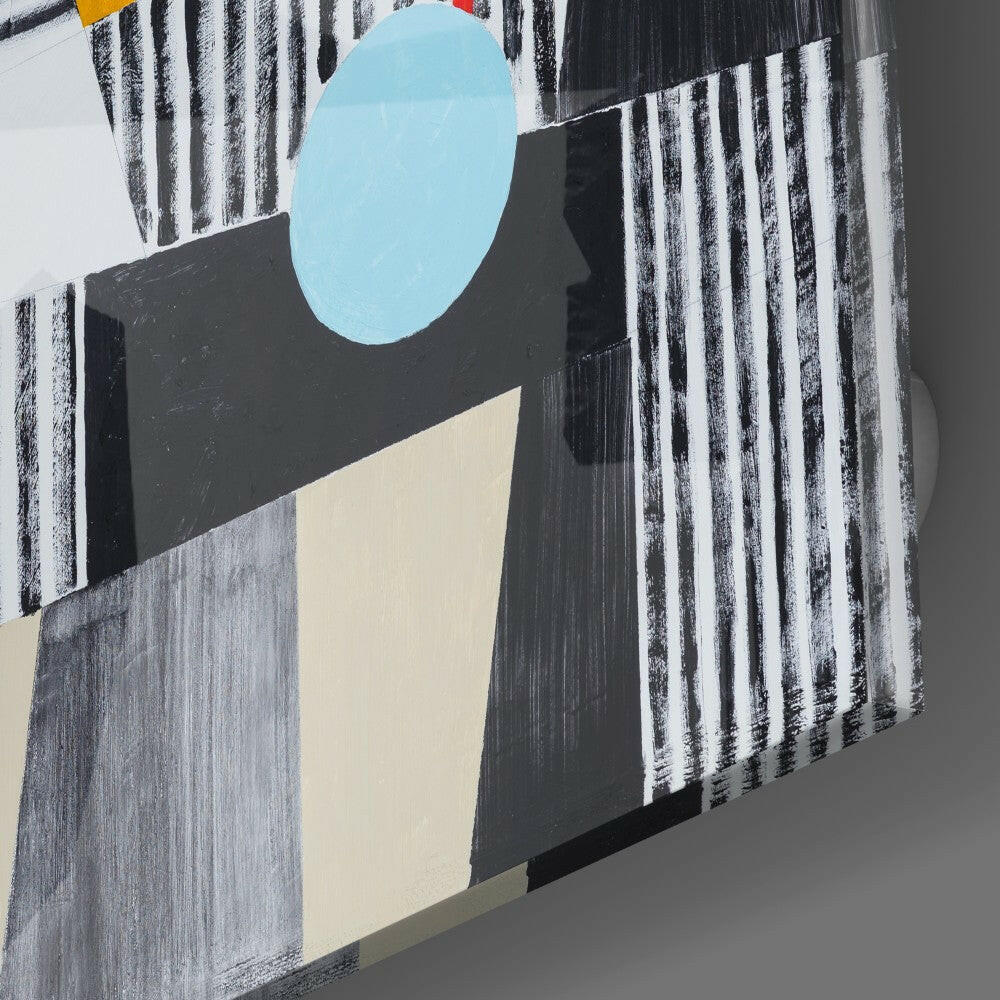 Angled view of Blue Dot Glass Wall Art displaying light blue circle, cream triangle, and black striped patterns on textured background.