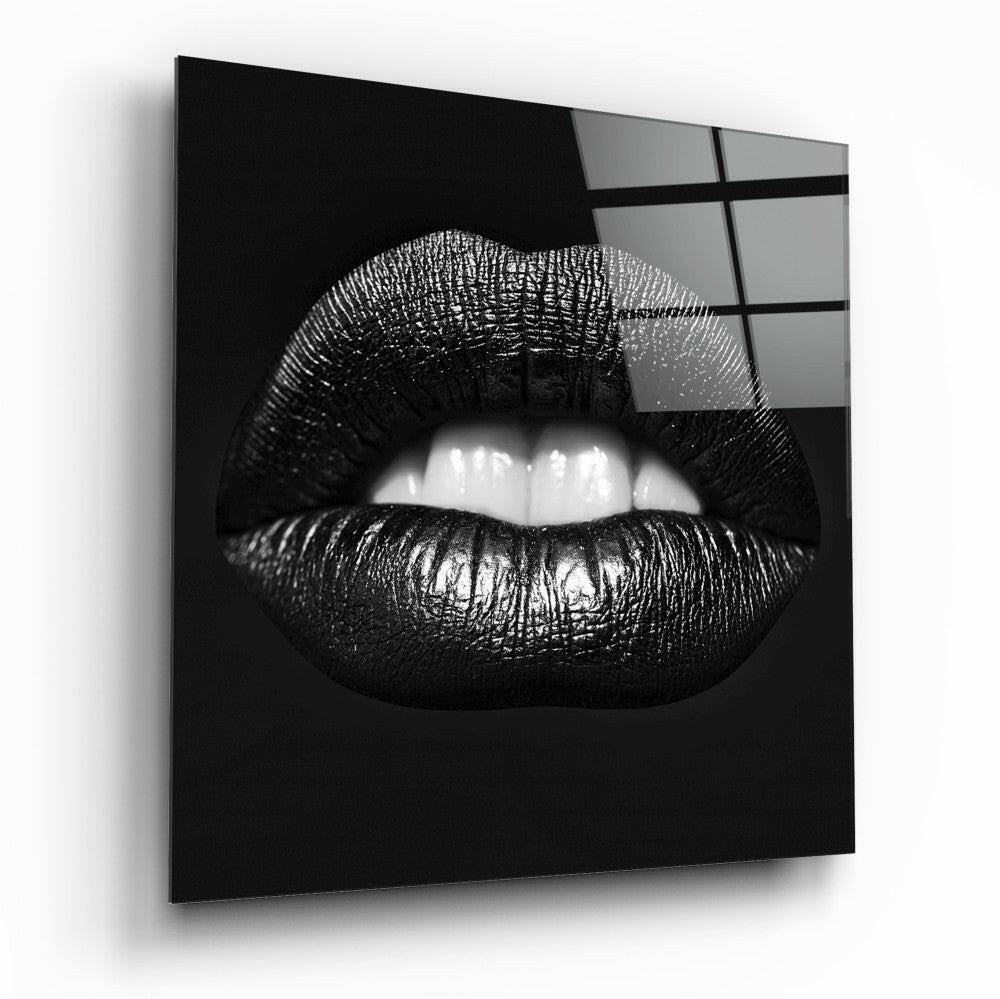 Black Lips Glass Wall Art displayed at an angle showing glossy black glass panel with white teeth detail and grid pattern overlay on upper right.