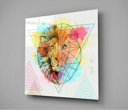 Glass wall art featuring a lion's head split between realistic detail and geometric polygon design, surrounded by watercolor splashes and triangular elements in pink, yellow, cyan, and orange on white background.