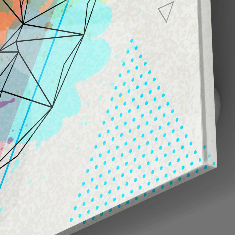 Close-up angled view of glass wall art showing cyan dotted pattern and colorful geometric design with black lines on white surface.
