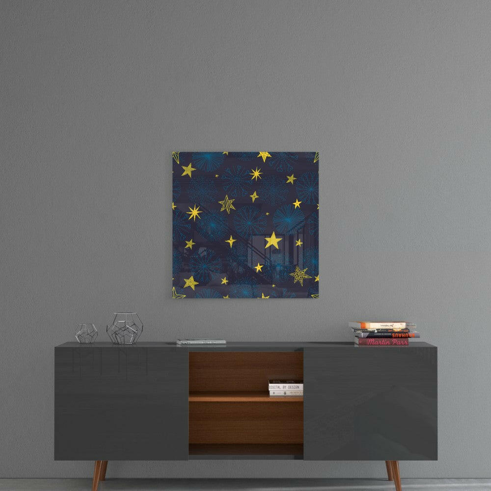 Square glass wall art with dark blue background, gold stars, and snowflake patterns hanging above mid-century modern credenza.