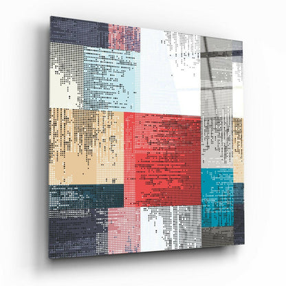 Angled perspective view of pixelated patchwork glass wall art displaying geometric blocks in red, teal, tan, gray, and white with dotted pattern overlay.