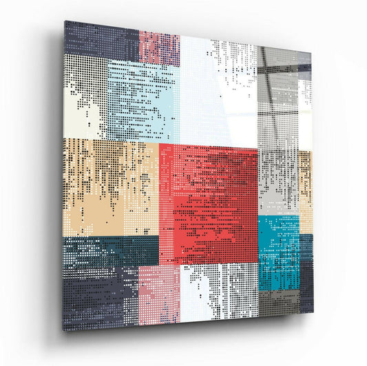 Angled perspective view of pixelated patchwork glass wall art displaying geometric blocks in red, teal, tan, gray, and white with dotted pattern overlay.
