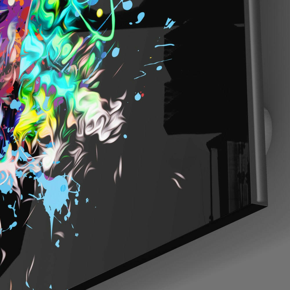 Angled side view of black glass wall art featuring a neon-colored skull with vibrant cyan, yellow, green, and purple swirls against dark background.