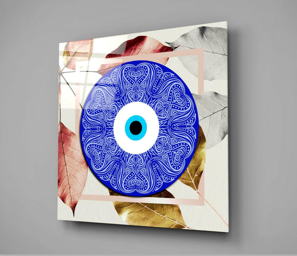 Square canvas displaying a blue ornamental evil eye with intricate white patterns, cyan pupil, surrounded by colorful autumn leaves and geometric shapes.