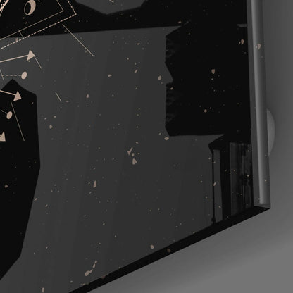 Close-up overhead view of Da Vinci Style Butterfly Glass Wall Art showing dark speckled glass surface with tan geometric line designs and scattered particles.