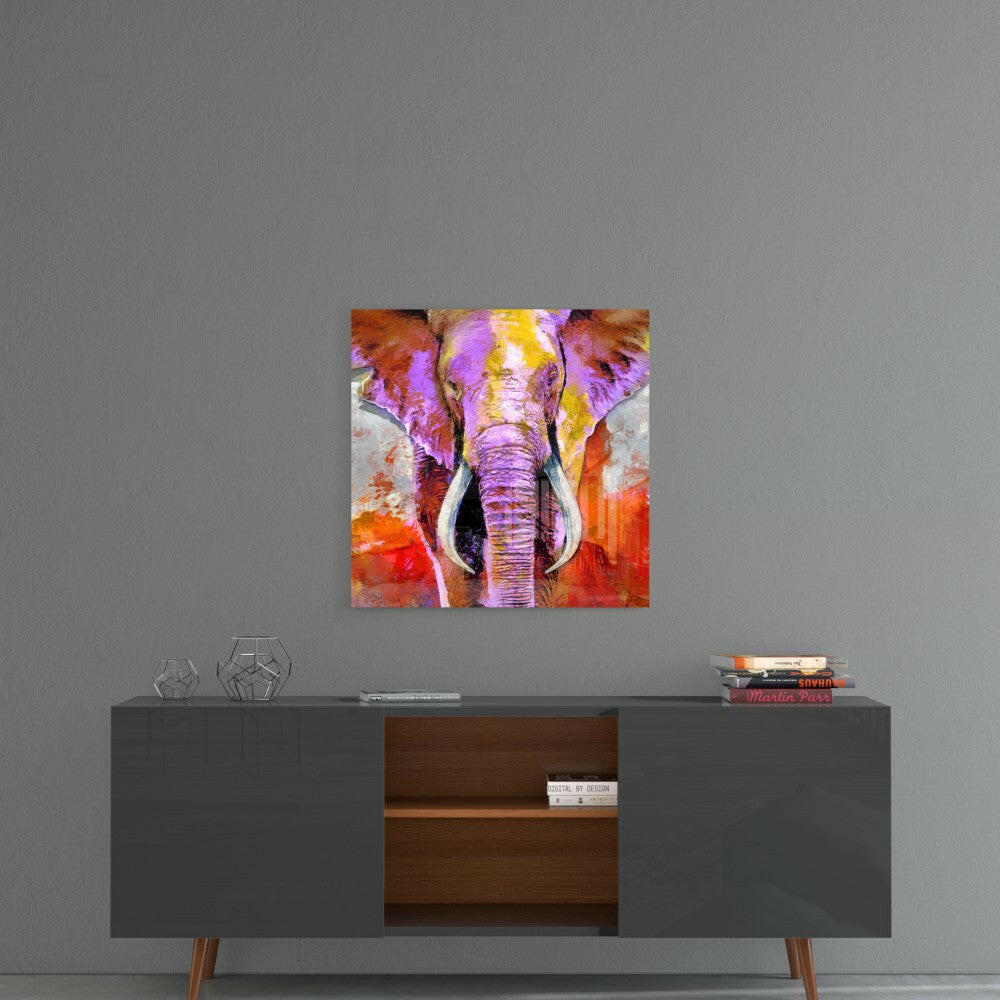 Colorful glass wall art featuring a purple, orange, and yellow elephant head hanging above a dark mid-century modern credenza.
