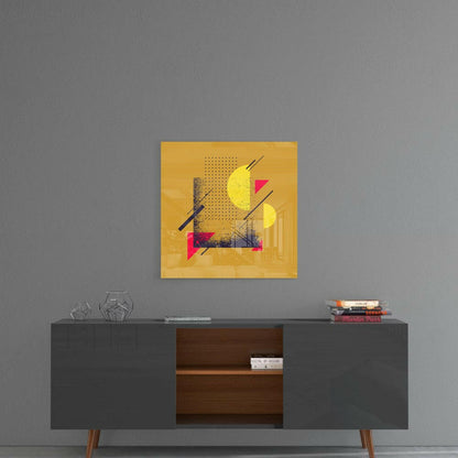 Yellow glass wall art with geometric shapes in pink, yellow, and black mounted above a dark mid-century modern credenza.