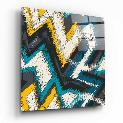 Modern glass wall art featuring abstract geometric design with yellow, teal, white, and gray brushstroke patterns.