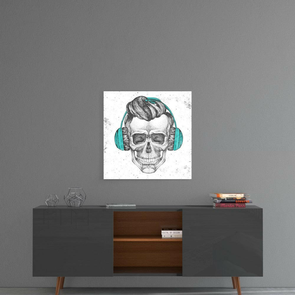 Glass wall art featuring a skull with stylized hair and turquoise headphones displayed above a mid-century modern credenza.