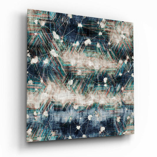 Angled view of glass wall art displaying interconnected white nodes on textured teal, navy, and cream botanical patterns with visible depth and shadow.