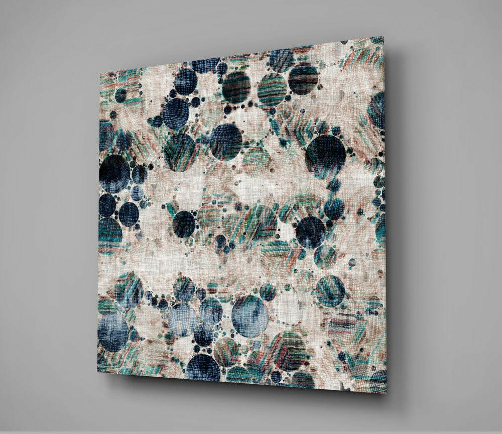 Canvas wall art displaying microscopic circular cellular structures in navy, teal, and cream on textured fabric, angled view.