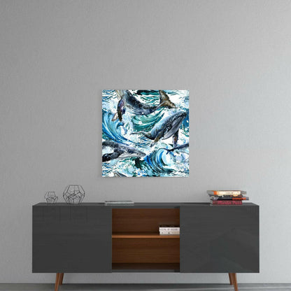 Glass wall art featuring stylized whales and swirling blue water patterns mounted above a mid-century modern console table.