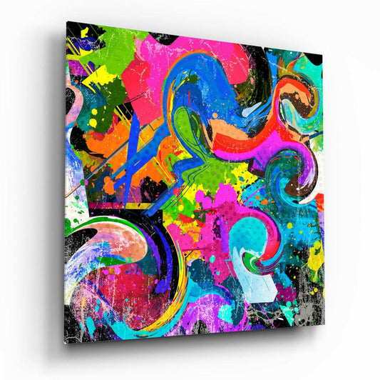 Angled perspective of vibrant multicolored glass wall art featuring abstract circles, splattered paint effects, and neon hues of pink, blue, yellow, and green.