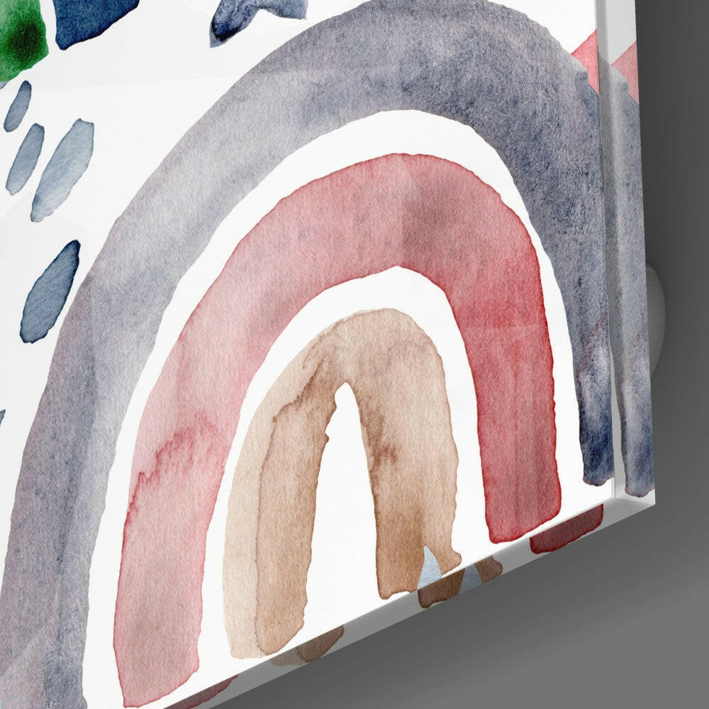 Close-up angled view of watercolor rainbow glass art featuring concentric arcs in gray, pink, and beige with blue brushstroke details.